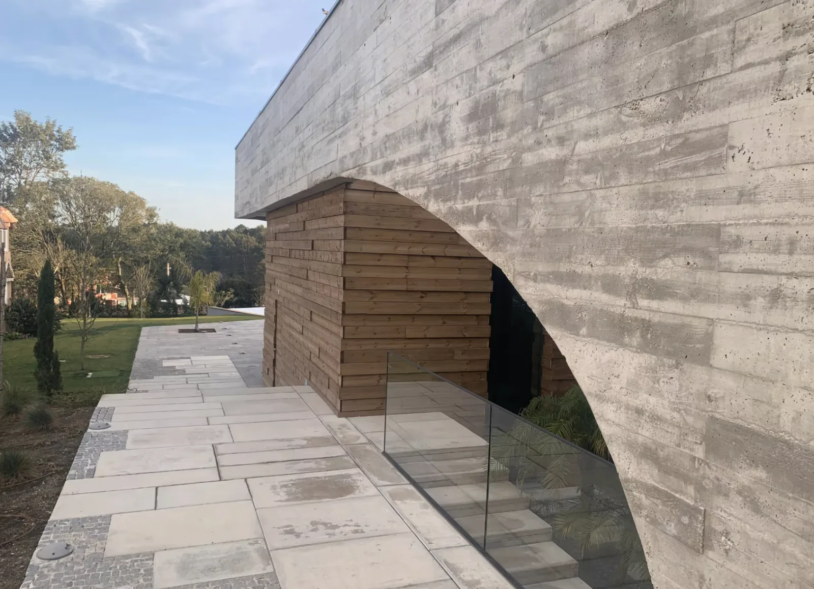 Concrete arch over the wooden entrance